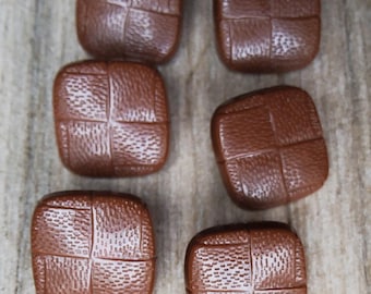 Vintage set of six realistic faux leather jacket buttons.