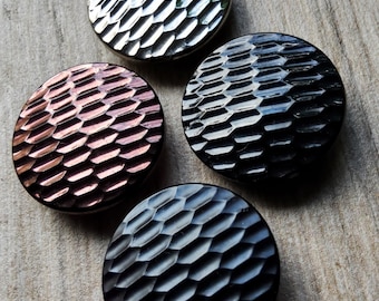 Vintage assorted collection of four large 1920-30's buttons.