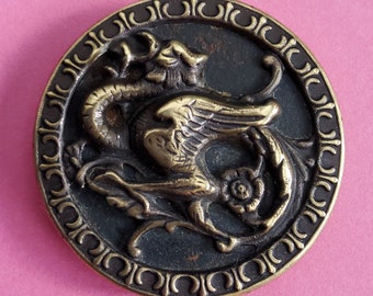 Vintage large 19th Century button of a Griffin.