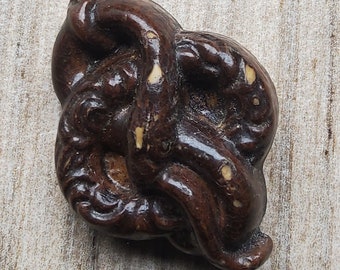 Vintage large 1930's coiled snake button.