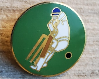 Vintage large enamel cricket button.