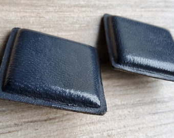 Vintage pair of large square leather buttons.