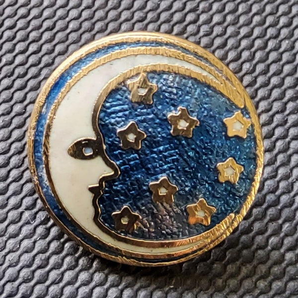 Vintage enamel moon and stars button.