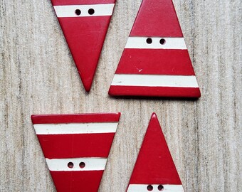 Vintage 1920-30's set of four red and white large triangular plastic buttons.