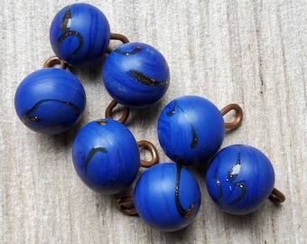 Vintage set of seven 1900's Blue swirl glass waistcoat buttons.