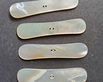 Vintage set of four large 1920's natural mother of pearl buttons.