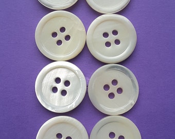 Vintage set of eight Mother of Pearl buttons.
