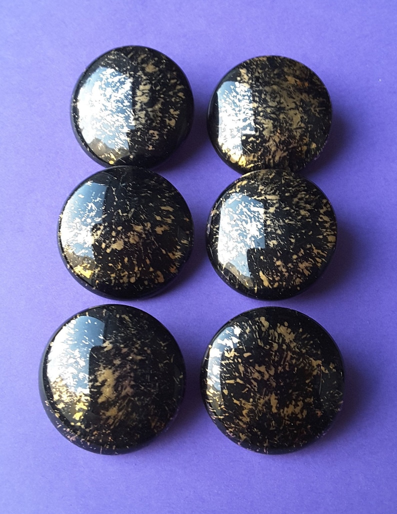 Vintage set of six large black and gold glass buttons.