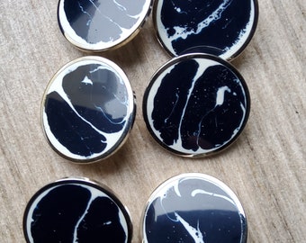 Vintage set of six black and white jacket buttons.