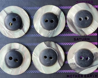 Set of six faux mother of pearl jacket buttons.