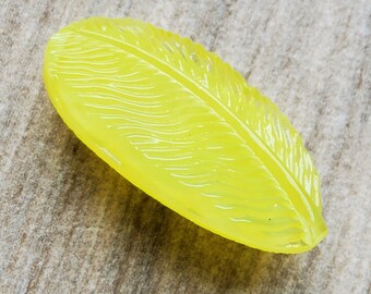 Vintage Moon glow glass yellow feather button.