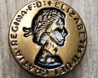 Vintage 1950’s commemorative Queen Elizabeth II button.