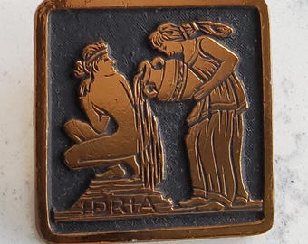 Vintage alloy metal 1950's Greek or Roman bathing scene button.