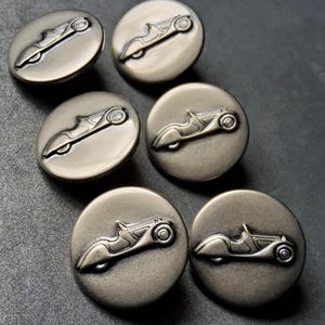 Vintage set of six vintage car buttons.