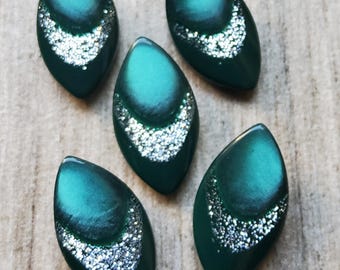 Vintage set of five acrylic sparkly green jacket buttons.