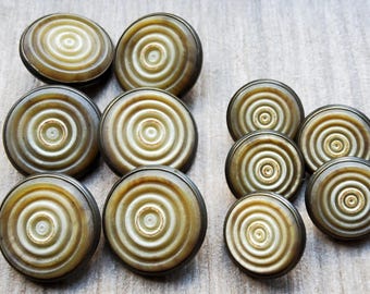 Vintage set of eleven faux horn coat buttons.