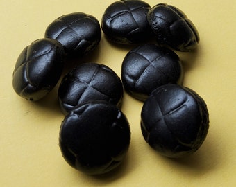 Vintage set of eight small black leather buttons.