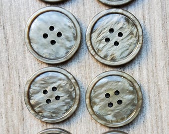 Vintage 1930's set of eight marbled plastic buttons.