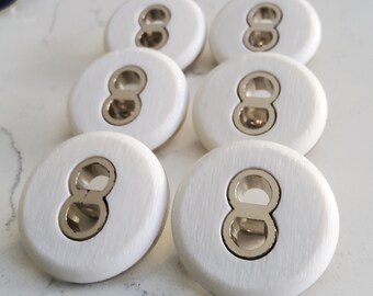 Vintage set of six large white and chrome coat buttons.