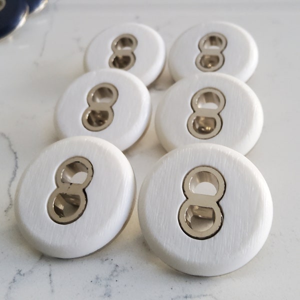 Vintage set of six large white and chrome coat buttons.