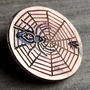 Vintage hand painted spider web and fly copper button.