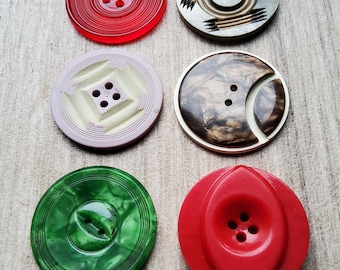 Vintage assorted collection of six large 1920 - 30's plastic buttons.