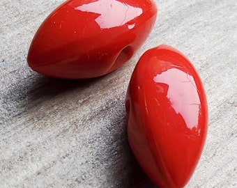 Vintage pair of 1920's red glass buttons.