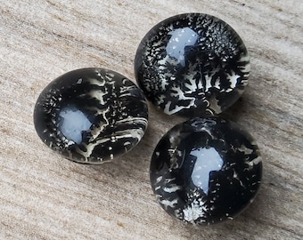 Vintage early 1900's set of three glass paperweight buttons.