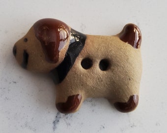 Vintage hand made pottery dog button.