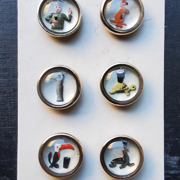 Vintage set of six white 1950's Guinness promotional buttons.