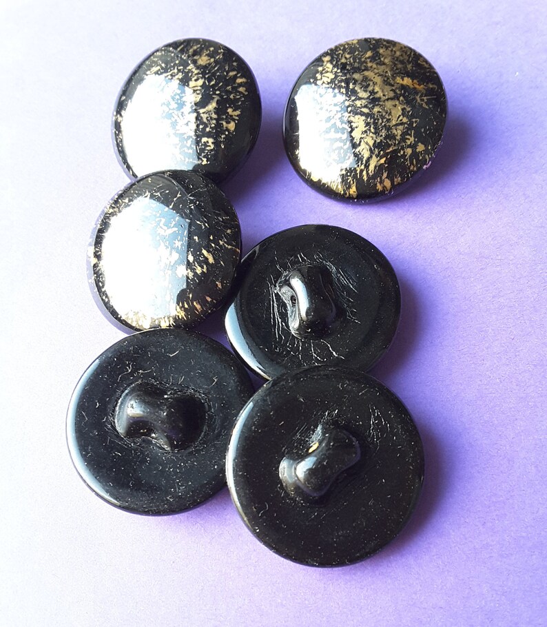 Vintage set of six large black and gold glass buttons.