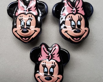 Vintage trio of large plastic Minnie Mouse buttons.