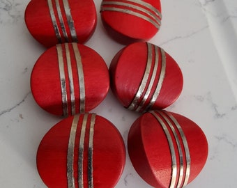 Vintage set of six 1930's red wooden coat buttons.