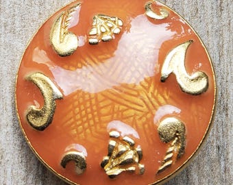 Vintage large 1980's metal enamel coat button.