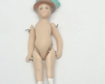 Doll with hat on.