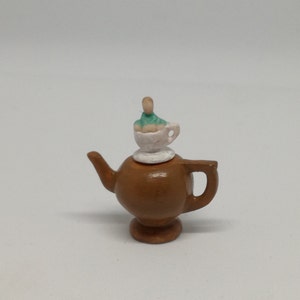 Teapotbrown - baby on a teacup