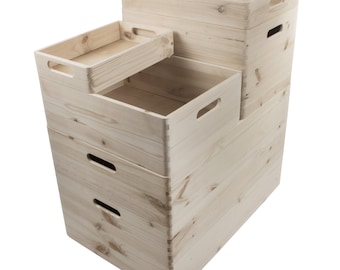 May include: Set of four natural wood storage boxes with handles. The boxes are stacked on top of each other, with the largest box at the bottom and the smallest box at the top.