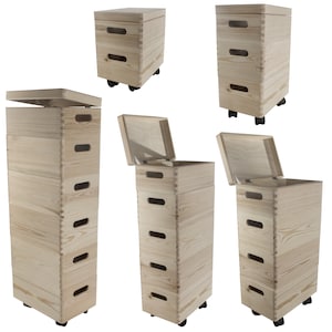 May include: Five wooden storage boxes with lids and wheels. The boxes are stacked in different configurations, with some lids open and some closed. The boxes are made of natural wood and have a rustic look.
