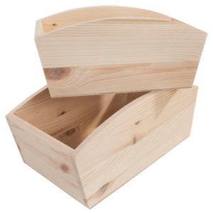 May include: Two unfinished wooden storage bins stacked on top of each other. The bins are rectangular with curved tops and are made of light-colored wood. The wood grain is visible, and the bins appear to be handmade.