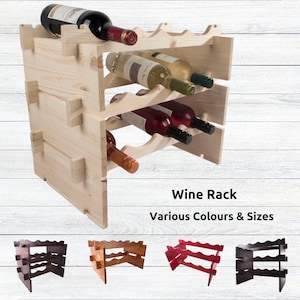 May include: A wooden wine rack with three tiers, holding bottles of wine. The rack is made of natural wood and has a rustic look. The rack is shown in four different colors: natural, brown, red, and black. The text "Wine Rack" and "Various Colours & Sizes" is displayed below the rack.