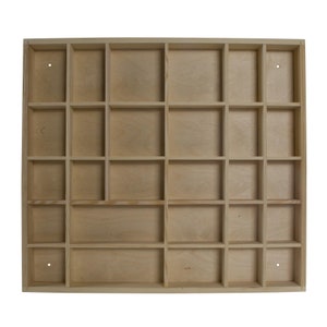 May include: A wooden storage box with 24 individual compartments. The box is made of light wood and has a natural finish.