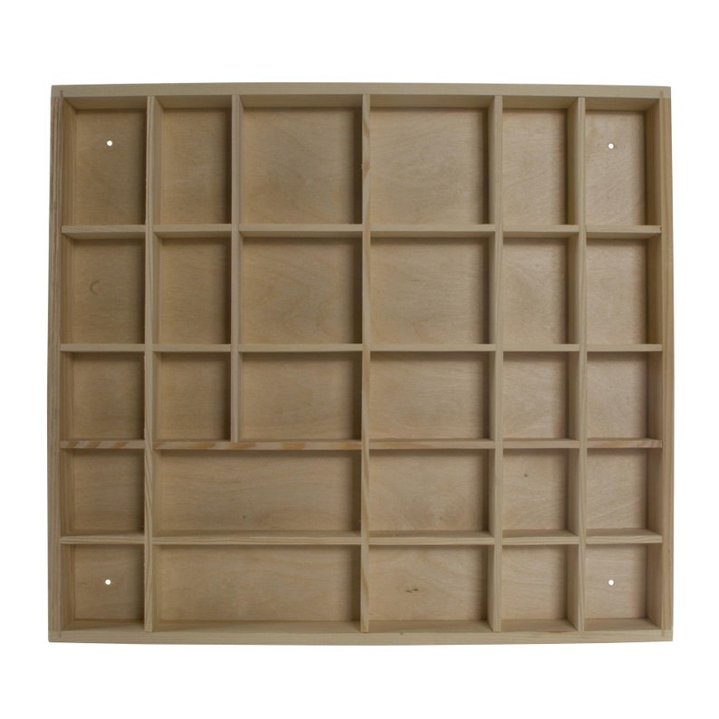May include: A wooden storage box with 24 individual compartments. The box is made of light wood and has a natural finish.