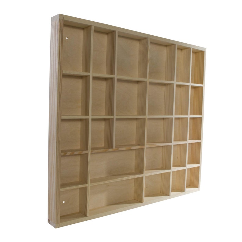 May include: A wooden shelf unit with 24 individual compartments. The shelf is made of unfinished pine wood and is ready to be stained or painted.