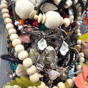 May include: A set of three ceramic mugs with a speckled, matte finish in cream, light grey, and dark grey. Each mug has a simple, minimalist design, ideal for coffee or tea.