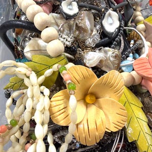 May include: A trio of ceramic mugs with a speckled, matte finish in cream, light grey, and dark grey. Each mug features a simple, modern design and a rounded handle. Ideal for tea or coffee.