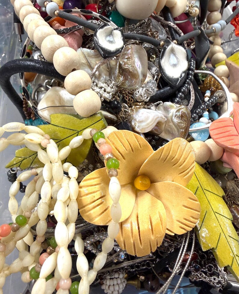 May include: A trio of ceramic mugs with a speckled, matte finish in cream, light grey, and dark grey. Each mug features a simple, modern design and a rounded handle. Ideal for tea or coffee.