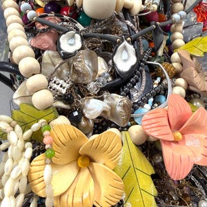 May include: A trio of ceramic mugs with a speckled, matte finish in cream, light grey, and dark grey. Each mug features a minimalist design and a rounded handle.