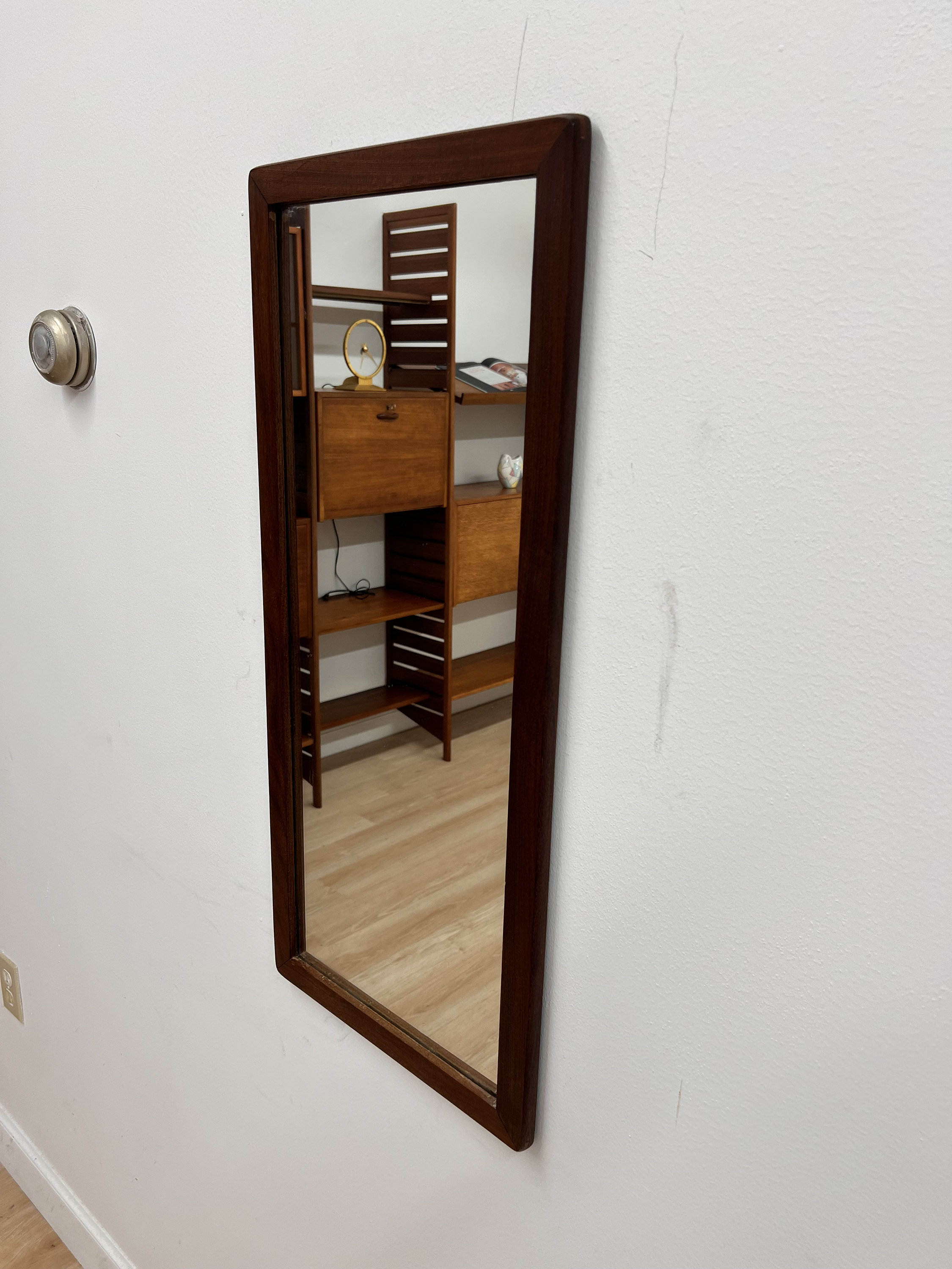 A mirror, teak, metal and faceted glass, 1950/60s. Mirrors
