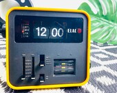 Vintage Flip Clock ELAC RD100, yellow, 70s