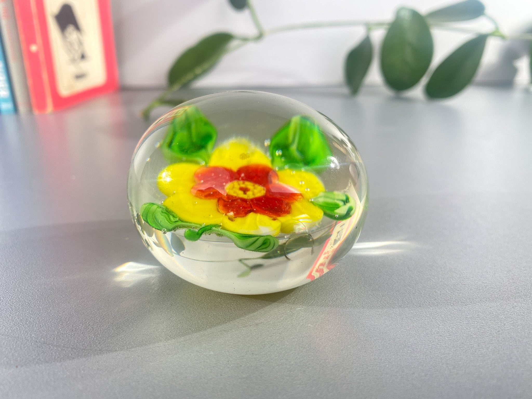 small paperweight made of glass with flower vintage